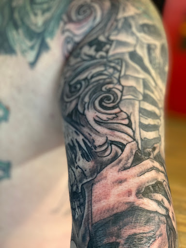 Explore shaded tattoo sleeve ideas, creative tattoo ideas in Pikeville, available at The Carbon Canary Tattoo Studio
