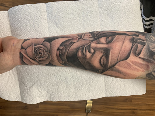 Explore filmmaker tattoo ideas, creative tattoo ideas in Lombard, available at New Hope Tattoo