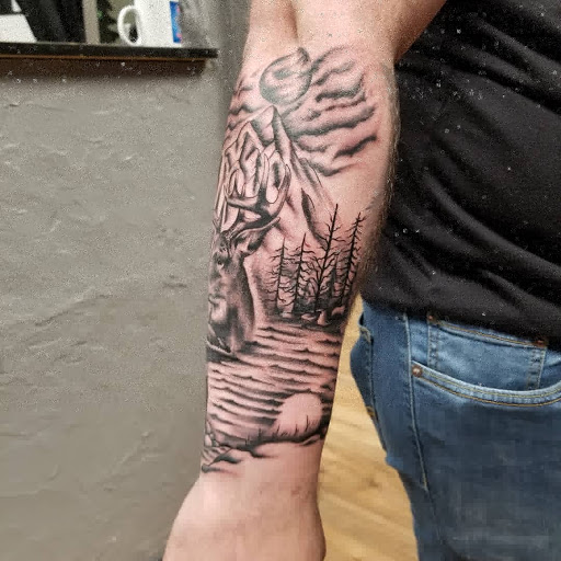 Explore wolf tattoo ideas for guys, creative tattoo ideas in Edinboro, available at No Regrets Tattoo (Appointment Only)