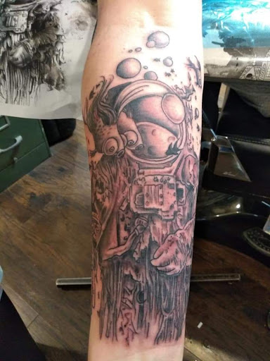 Explore bear sleeve tattoo ideas, creative tattoo ideas in Fairmont, available at Derma Doodlezz