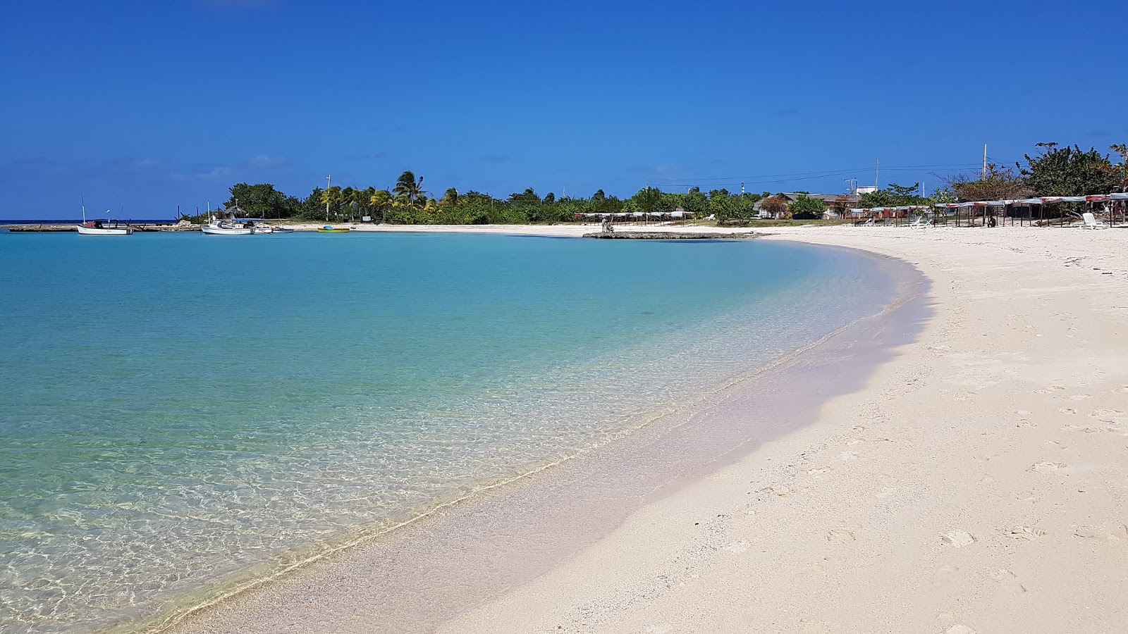 Photo of La Herradura with bright fine sand surface