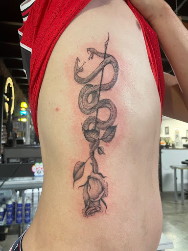 Explore fantasy book tattoo ideas, creative tattoo ideas in Cocoa Beach, available at The Corner Tattoo and Piercing Studio