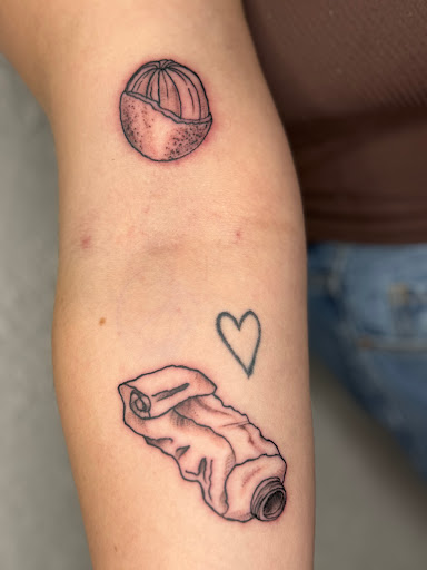 Explore m&m tattoo ideas, creative tattoo ideas in Milwaukee, available at The Skin Museum