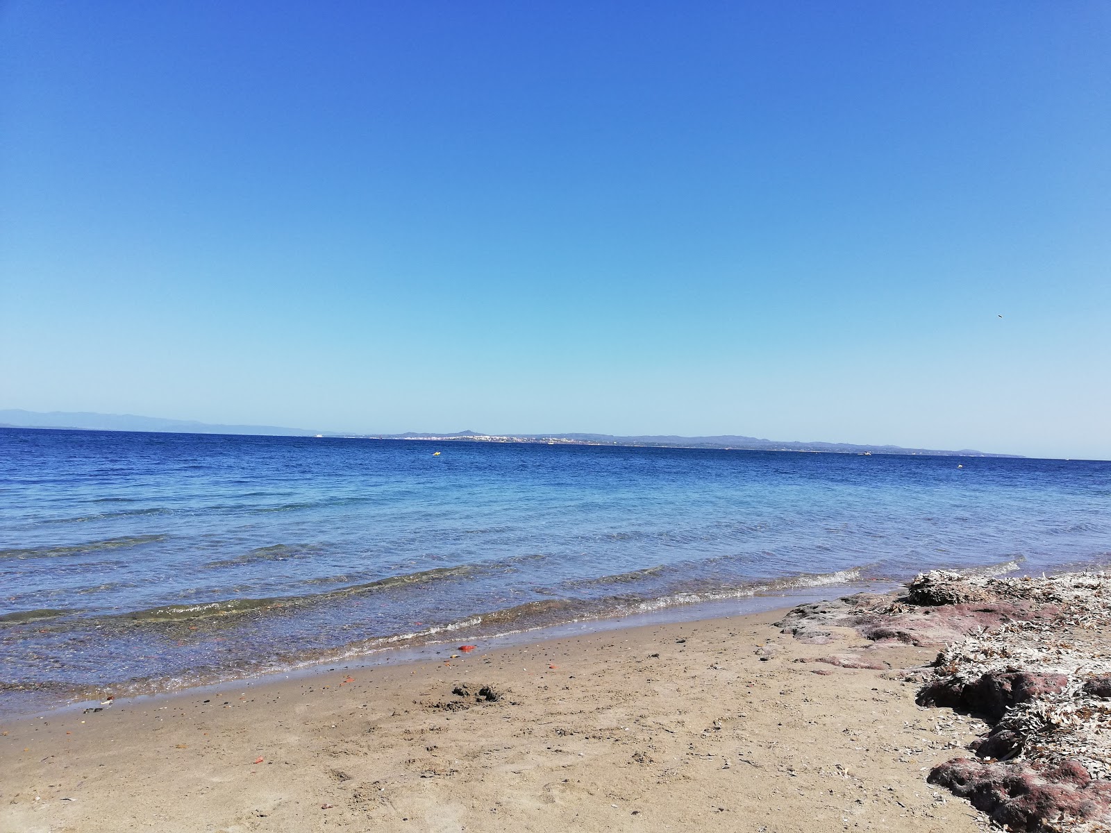 Foto av Spiaggia di Dietro ai Forni med turkos rent vatten yta