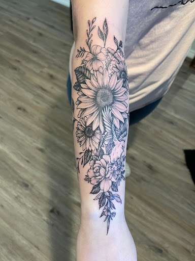 Explore cover up tattoo ideas for upper arm, creative tattoo ideas in Elko, available at Freedom Tattoo