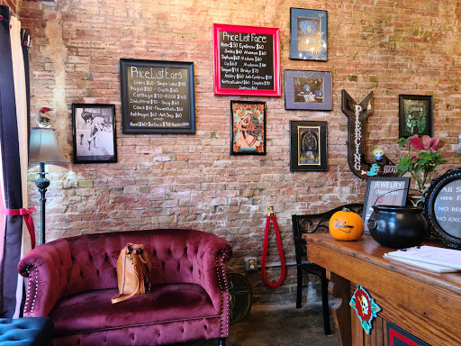 Explore red ink tattoo ideas, creative tattoo ideas in Mckinney, available at The Magic Needle Piercing Studio