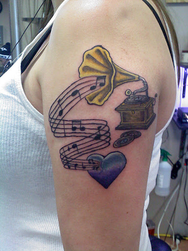 Explore cover up tattoo ideas for upper arm, creative tattoo ideas in Cottonwood, available at Ink Impression Tattoo