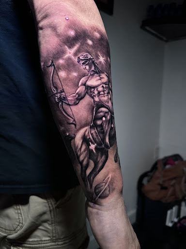 Explore blacked out tattoo ideas, creative tattoo ideas in Riverview, available at 9-Line Tattoo