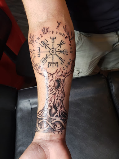 Explore flag tattoo ideas, creative tattoo ideas in Clarkston, available at Koby Hardy Piercing & Tattoo