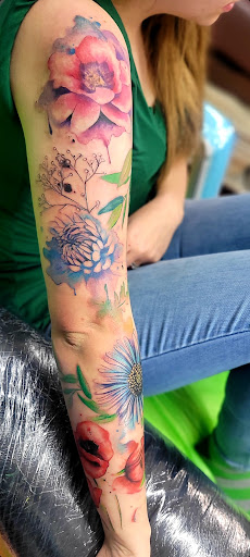 Explore female wrist tattoo ideas, creative tattoo ideas in Benton, available at Spectrum Tattoo