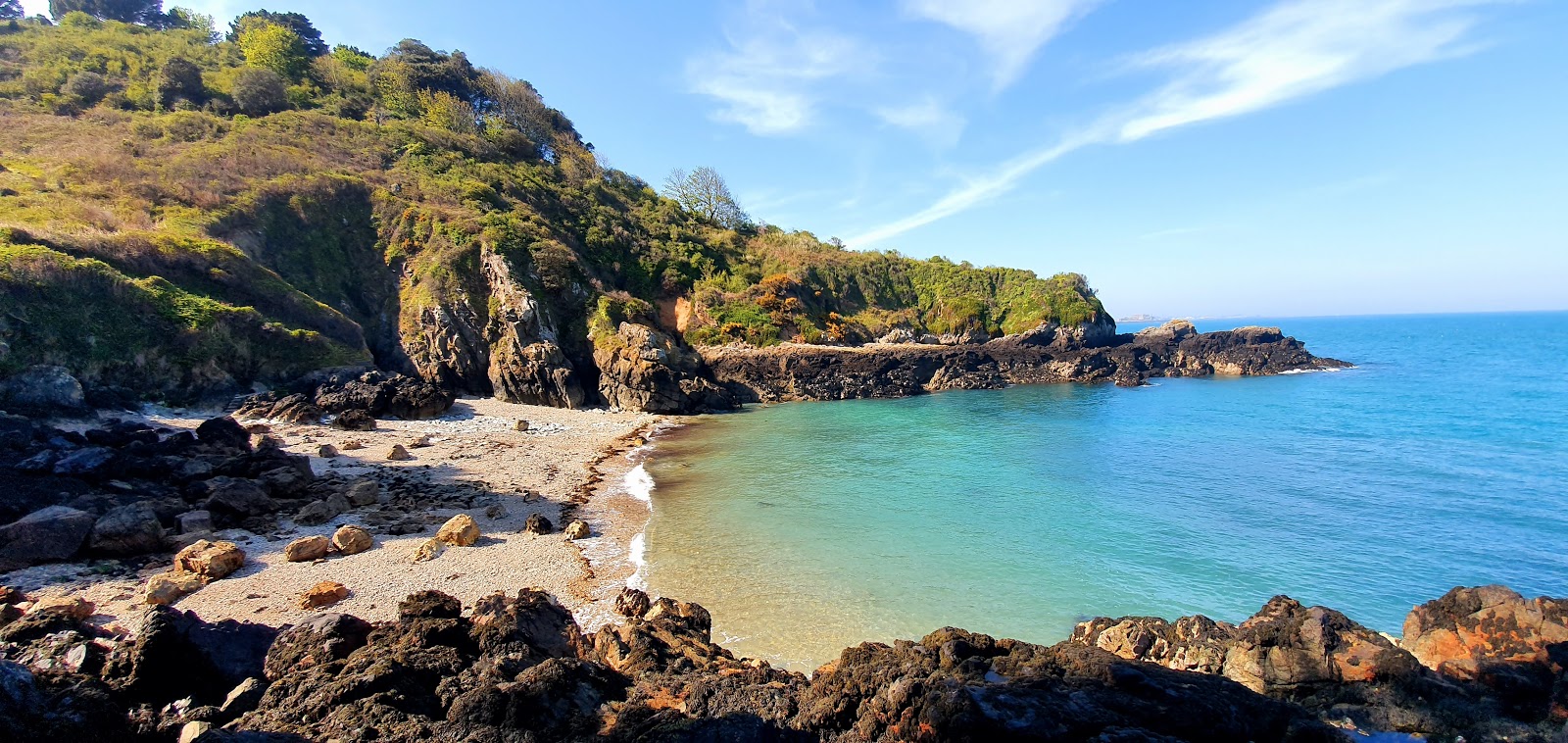 Foto von Le Pied du Mur (Marble Bay) mit beiger kiesel Oberfläche