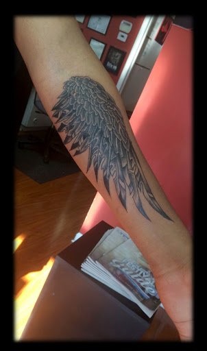 Explore kneecap tattoo ideas, creative tattoo ideas in Warren, available at Elite Ink Tattoo Studios
