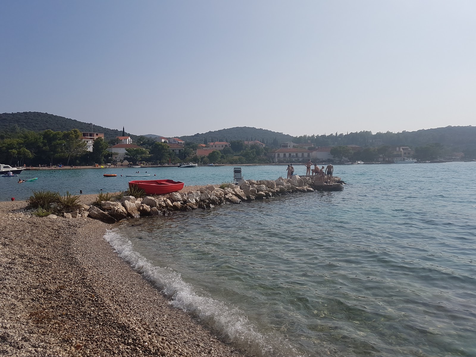 Photo of Denka beach with turquoise pure water surface