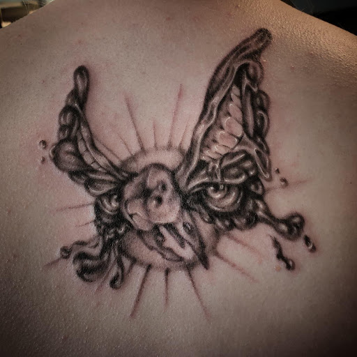 Find tattoos on chest ideas for your next unique tattoo in Palm Harbor at Angry Owl Tattoo and Piercing