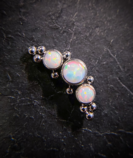 Explore small raven tattoo ideas, creative tattoo ideas in Springfield, available at Body Piercing By Qui Qui