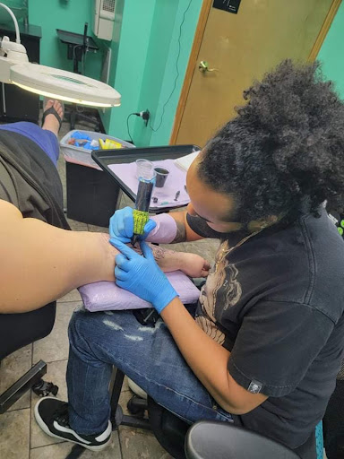 Explore last name tattoo ideas on arm, creative tattoo ideas in Fort Wayne, available at Grade A Tattoos and Body Piercing