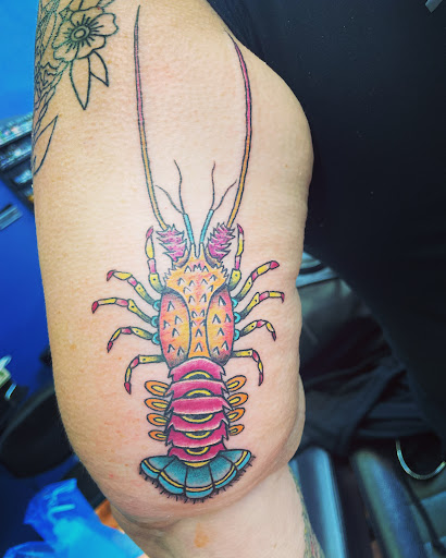 Explore flower spine tattoo ideas, creative tattoo ideas in Cocoa, available at Rorschach Tattoo Shop and Piercing Studio