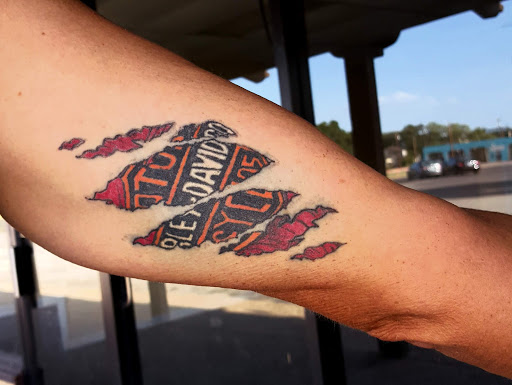 Explore harmonica tattoo ideas, creative tattoo ideas in San Angelo, available at Alchemy Tattoo and Piercing Studio