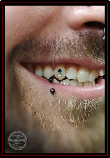 Find small tattoo between breast ideas for your next unique tattoo in Omaha at Eternal Tattoo & Body Piercing - Omaha