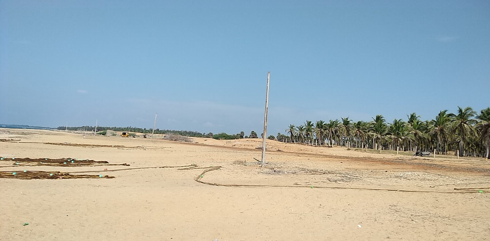 Fotografija Pudumadam Beach in naselje