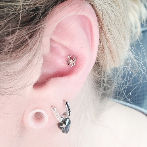 Explore gladiolus tattoo ideas, creative tattoo ideas in Bethlehem, available at Obsidian Tattoo and Piercing Parlor