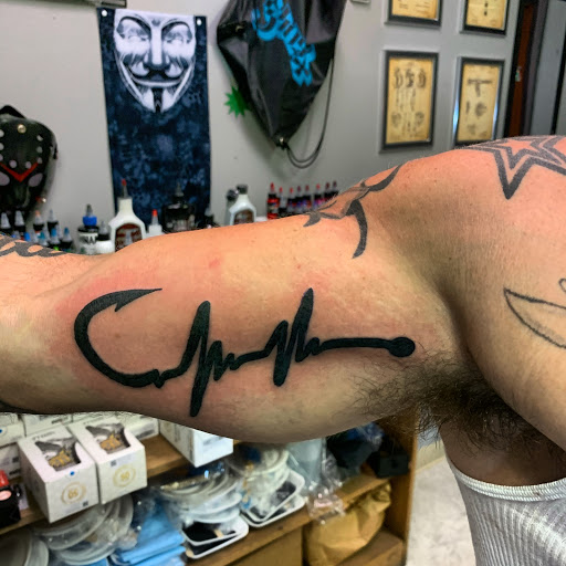 Explore side tattoo ideas for men, creative tattoo ideas in Hudson Falls, available at ALTERED ADDICTION TATTOOS