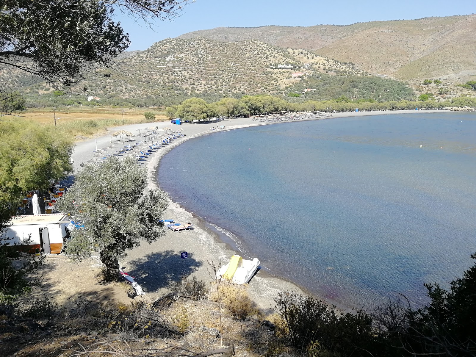 Photo of Paralia Charamida with turquoise pure water surface