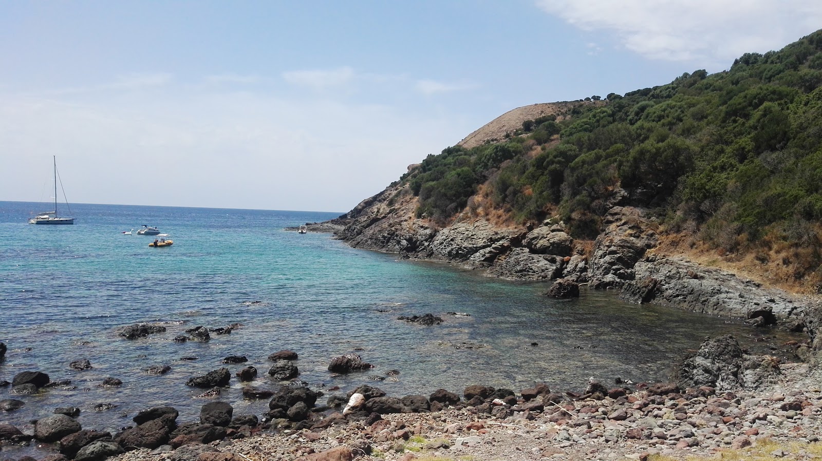 Foto van Porto Managu beach met turquoise puur water oppervlakte