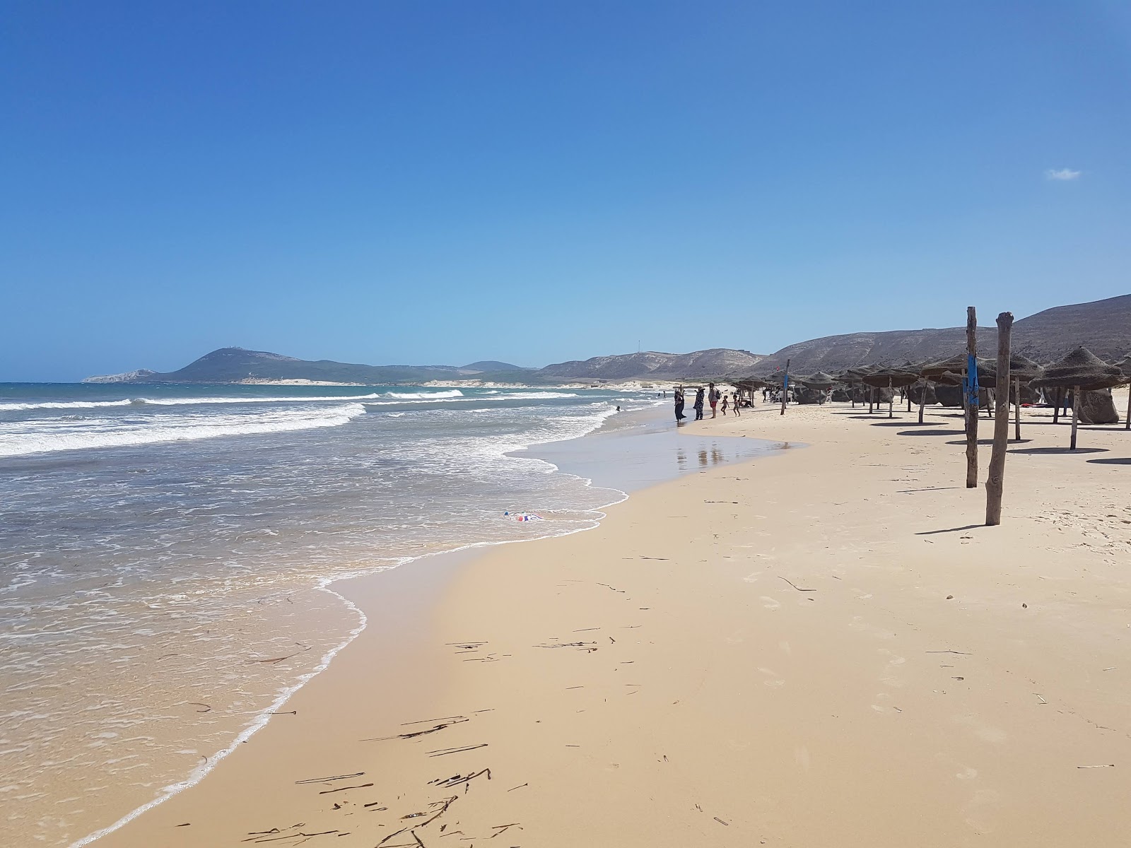 Fotografija Ras Angela Beach z svetel fin pesek površino