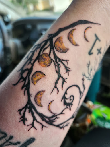 Explore astronaut tattoo ideas, creative tattoo ideas in Davenport, available at Fine Ink Studios Tattoos