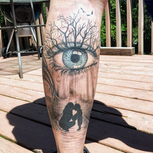 Explore eye tattoo ideas for guys, creative tattoo ideas in Loganville, available at Blue Siren Tattoos