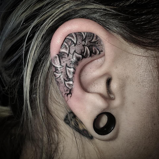 Explore 2 dog tattoo ideas, creative tattoo ideas in Palm Harbor, available at Angry Owl Tattoo and Piercing