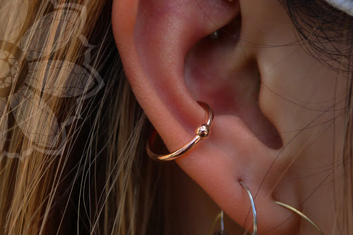 Explore small spider tattoo ideas, creative tattoo ideas in Honolulu, available at Honolulu Piercing Company at Skin Deep Tattoo Waikiki