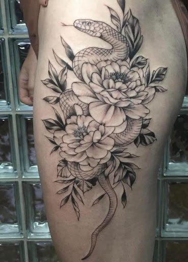 Find low back tattoo ideas for your next unique tattoo in Buffalo at Vagabond Ink Tattoo Parlor