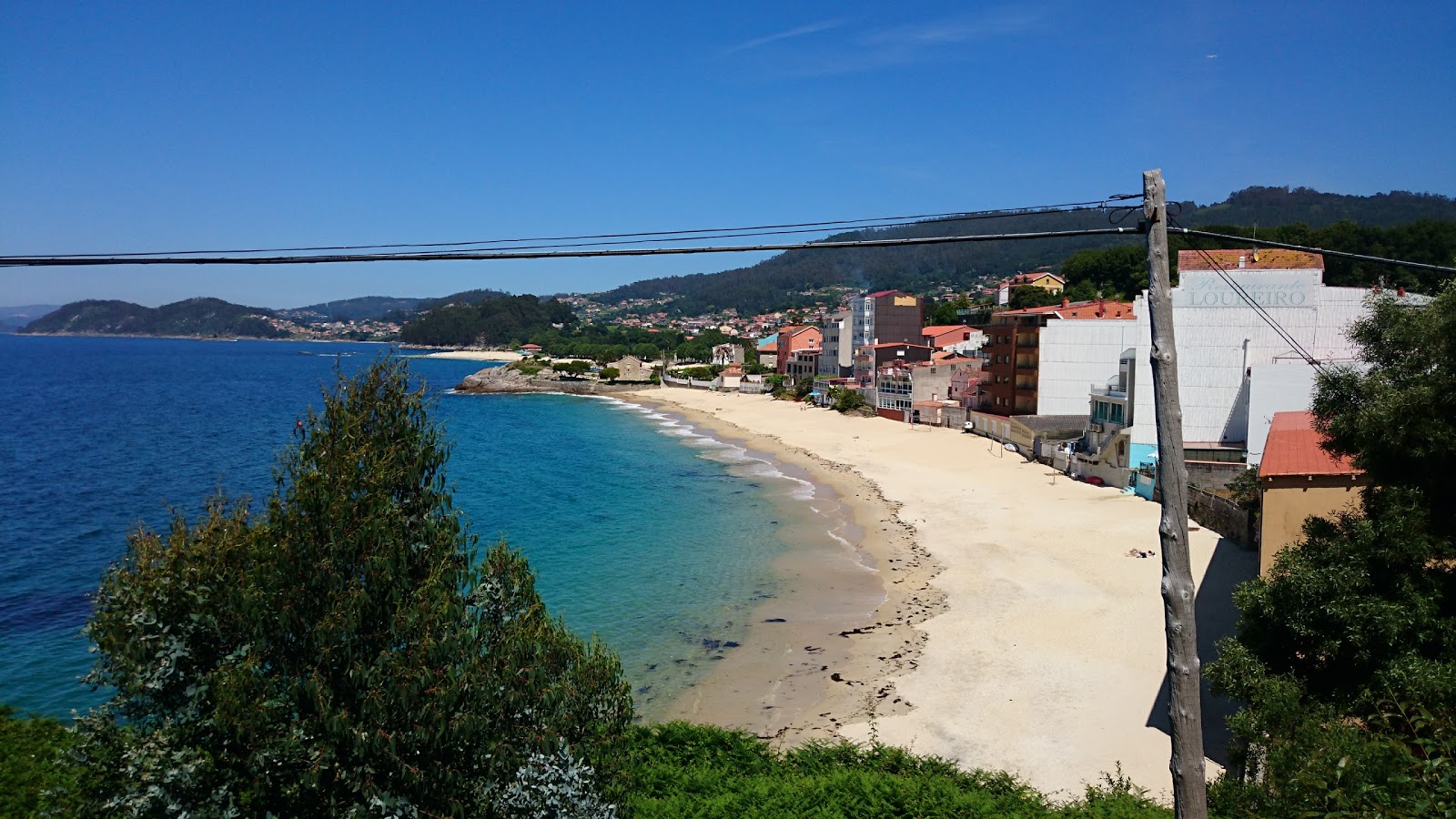 Praia Agrelo Portomaior'in fotoğrafı geniş bir kıyı şeridi ile birlikte