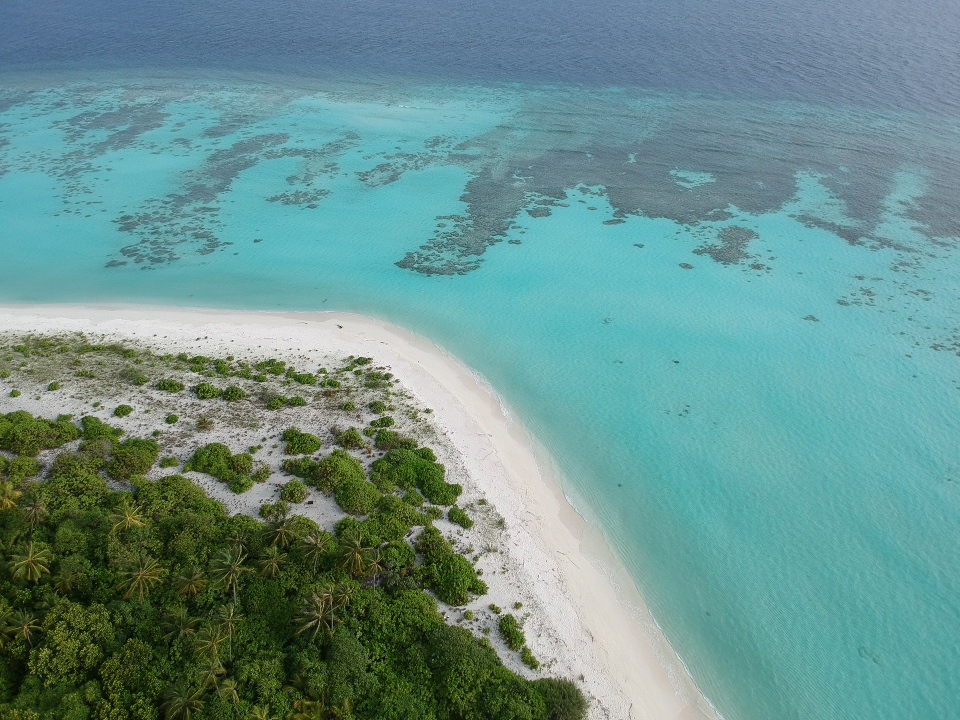 Photo of Raafushi Beach with turquoise pure water surface