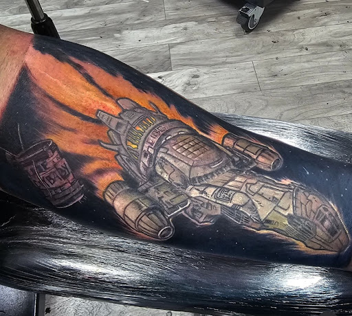 Explore cover up tattoo ideas for upper arm, creative tattoo ideas in Kenosha, available at Kenosha Tattoo Company