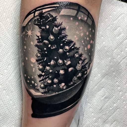 Explore flower spine tattoo ideas, creative tattoo ideas in Senoia, available at Messenger Tattoo Studio