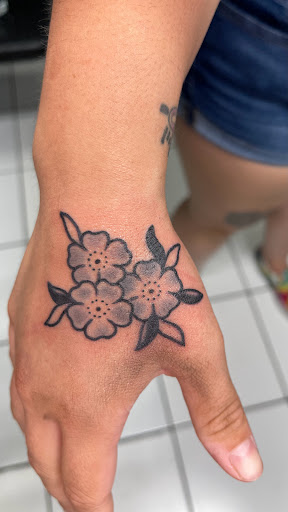 Explore simple hand tattoo ideas, creative tattoo ideas in Green Bay, available at Sanctuary Tattoo Studio