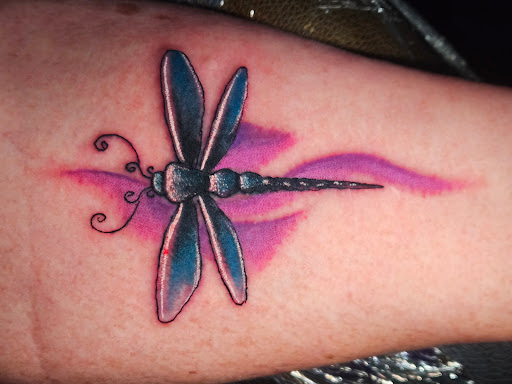 Explore bite mark tattoo ideas, creative tattoo ideas in Angola, available at Hoodlum Ink