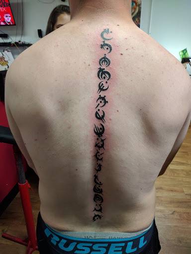 Explore calf tattoo ideas for men, creative tattoo ideas in Akron, available at Knuckle Up Ink Tattoos