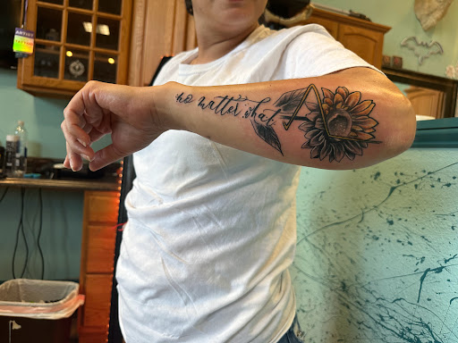 Explore black tattoo ideas for men, creative tattoo ideas in Pueblo, available at Spellbound Electric Tattoos