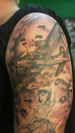 Explore men's back of neck tattoo ideas, creative tattoo ideas in Fritch, available at Stars & Stripes Electric Tattoos