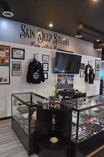 Find beach scene tattoo ideas for your next unique tattoo in Roscoe at Skin Deep Studio Body Art & Beauty