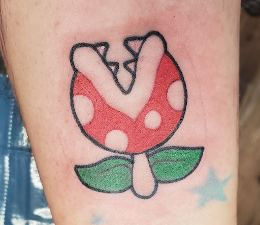 Explore cosmos flower tattoo ideas, creative tattoo ideas in Middletown, available at No Mans Land Tattoo Parlor