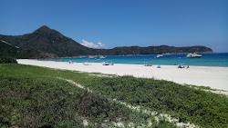 Tai Wan'in fotoğrafı dağlarla çevrili