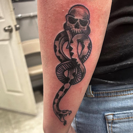 Explore last name tattoo ideas on arm, creative tattoo ideas in Hudson Falls, available at ALTERED ADDICTION TATTOOS