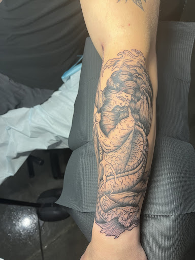 Explore dark skin male black skin tattoo ideas, creative tattoo ideas in Jensen Beach, available at Treasure Coast Tattoo Co.