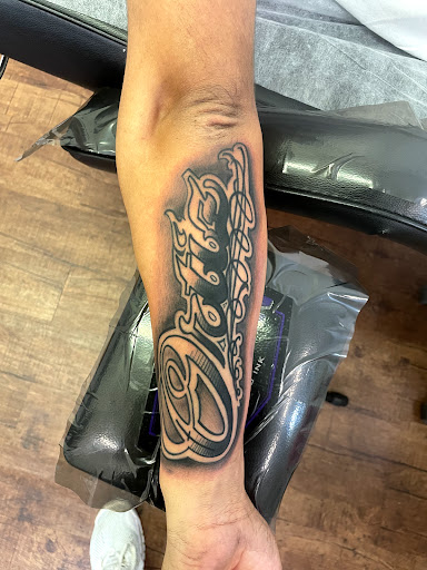 Explore guitar tattoo ideas, creative tattoo ideas in Rogers, available at Ink Solutions Tattoo