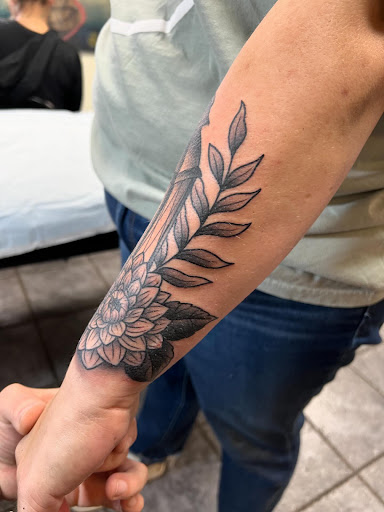 Explore flower ankle tattoo ideas, creative tattoo ideas in Ocala, available at Cobra Classic Tattoo